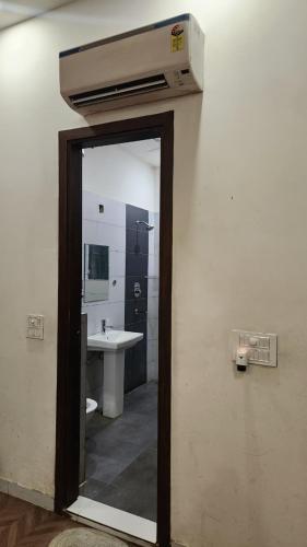a bathroom with a sink and a mirror at Hotel Surya Inn in Jāmb