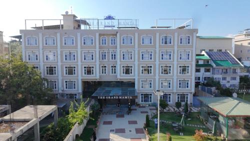 an aerial view of a large white building at The Grand Mamta in Srinagar