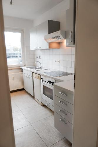 Η κουζίνα ή μικρή κουζίνα στο M House Do City Privatzimmer mit Balkon & Self Check-in