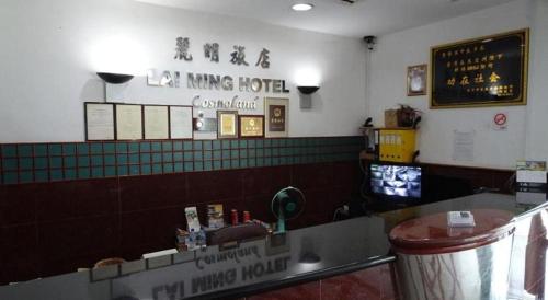 a fast food restaurant with a sink and a counter at Lai Ming Hotel Cosmoland in Singapore