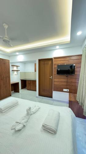 Katil atau katil-katil dalam bilik di Pearl Residency Kalady
