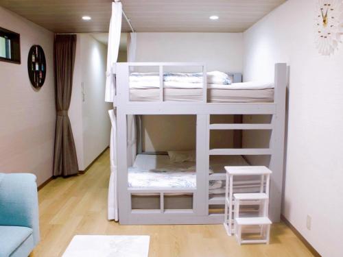 Ein Bett oder Betten in einem Zimmer der Unterkunft かくれの宿 柚子