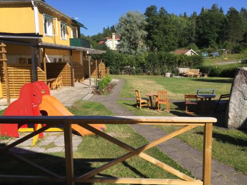 a backyard with a playground with a table and chairs at Motel E4 Kolmården Apartments And Cottages in Kolmården