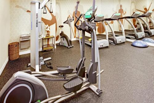a gym with a bunch of exercise bikes in a room at MainStay Suites Greensboro in Greensboro