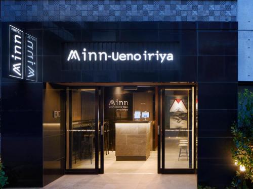 a store front of a building with a sign on it at Minn Ueno Iriya in Tokyo