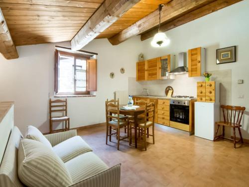 a kitchen and living room with a table and chairs at Holiday Home in Città di Castello with Pool in Città di Castello