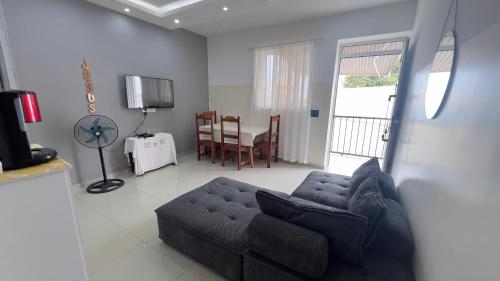 a living room with a couch and a table at Apartamentos t2 centro in Tarrafal