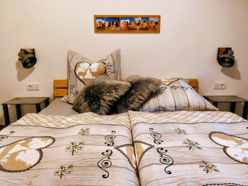 a cat laying on top of a bed at Ferienwohnung Finala in Gaschurn