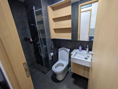 a bathroom with a toilet and a sink and a shower at The Luxe & Colony Infinitum KLCC by CoupleStay in Kuala Lumpur