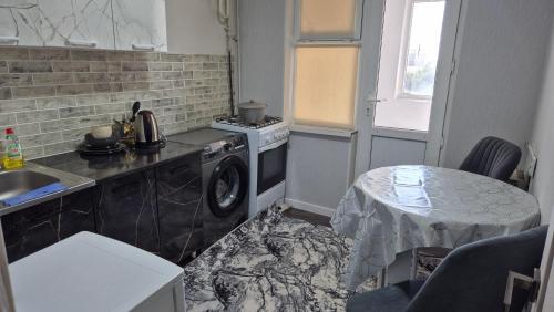 Η κουζίνα ή μικρή κουζίνα στο Abek Apartments