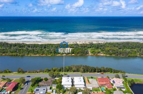 an overhead view of a beach with a water tower at Tropical Oasis - Creekside Townhouse by uHoliday in Pottsville