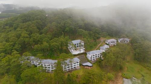 an aerial view of a house in the middle of a forest at Haven in the Pines in Ðinh An (2)