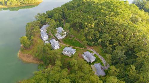 an aerial view of a house on an island next to a river at Haven in the Pines in Ðinh An (2)