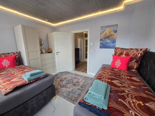 a room with two beds and a couch in it at HR Haus unter den Linden in Coesfeld
