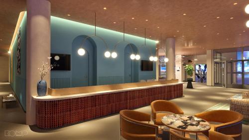 a lobby with a bar with chairs and tables at Hotel Lycium Debrecen - Handwritten Collection (October 2025) in Debrecen