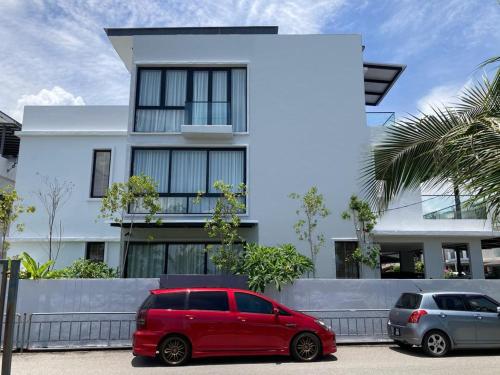 a red car parked in front of a white house at Seaview Master Room - Ensuite Bath in Butterworth in Butterworth