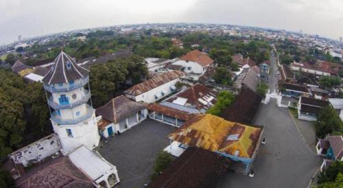 an aerial view of a building with a tower at Larisae Setia Kawan Hotel in Solo