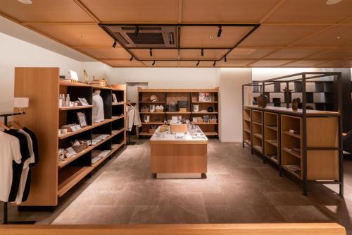 a clothing store with a lot of shelves at OND HOTEL（オンドホテル） in Takeo
