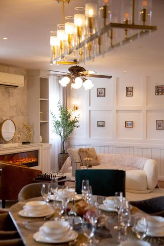 a living room with a dining table and a fireplace at Penthouse The Olaf at Chiang Mai's Old Town Suandok Gate I Entire Villa Booking I 4 Bedrooms I in Chiang Mai