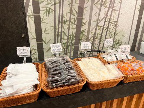 a group of baskets sitting on top of a table at HOTEL WINDS ASAKUSA Capsule Inn 浅草 in Tokyo