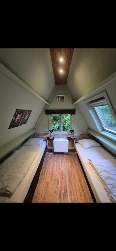 a room with two beds in a attic at Bois d' Paix in Durbuy