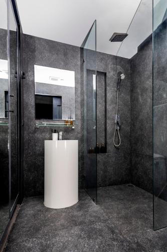 a bathroom with a shower and a sink at City gate apartment in Ban Nong Chaeng
