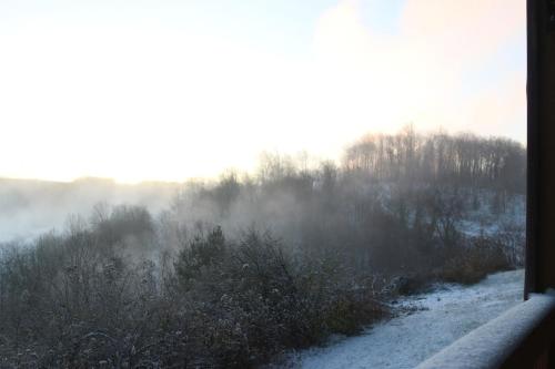 a view from a window of a snow covered field at Winterplace Ski In Ski Out First Floor D104 in Ghent