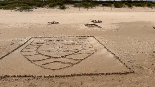 a drawing in the sand on a beach at Four bedroomed Townhouse in Letterkenny