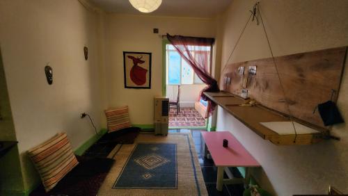 a room with a sink and a table and chairs at Private Room Central, Quite & Beautiful Flat in Cairo