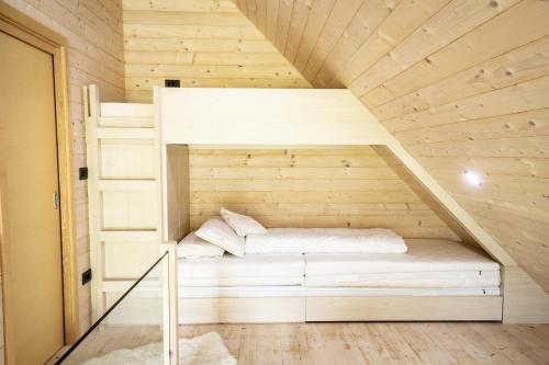Ένα ή περισσότερα κρεβάτια σε δωμάτιο στο Chalet Aurora