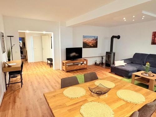 a living room with a couch and a table at Familienapartment in Bad Orb