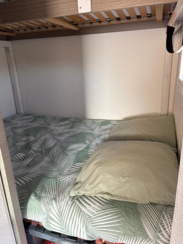 a bed in a small room with a bed frame at BORD DE MER in Port Leucate