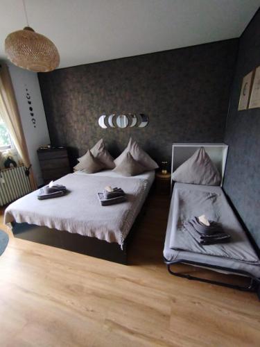 a bedroom with a bed and a chair in it at BOHO Apartment Elegance in Bad Reichenhall