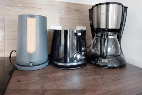two black and silver appliances sitting on a counter at Küstenliebe-Fehmarn in Fehmarn