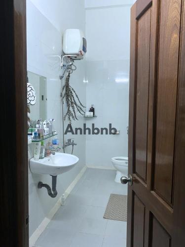 a bathroom with a sink and a toilet at Anhbnb in Danang