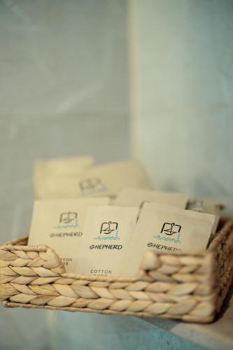 a wicker basket with boxes of soap on it at Shepherd I Dahabya in Esna