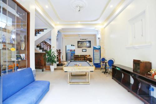 a living room with a pool table in it at Hue Imperial Hostel in Hue
