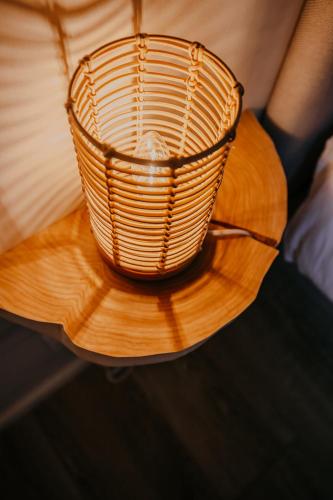 a wicker basket sitting on top of a wooden table at La Villa de Pen ar Menez terre & mer avec spa in Plouider