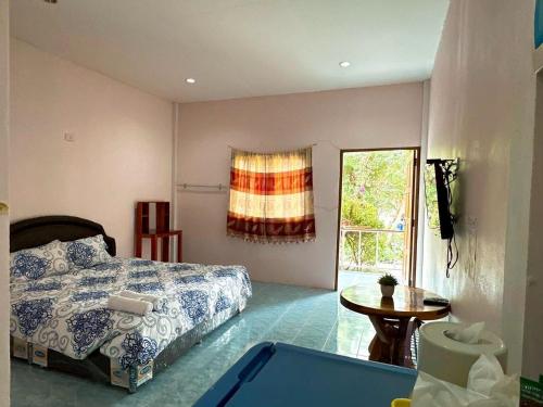 Postel nebo postele na pokoji v ubytování อวบอิ๋มรีสอร์ท #ที่พักภูกระดึง