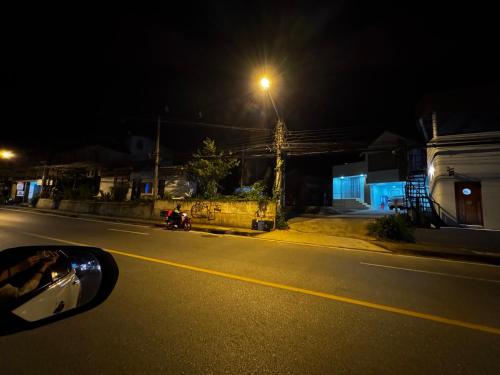 a car parked on the side of a street at night at Serenity House 4A in Ban Nong Chaeng