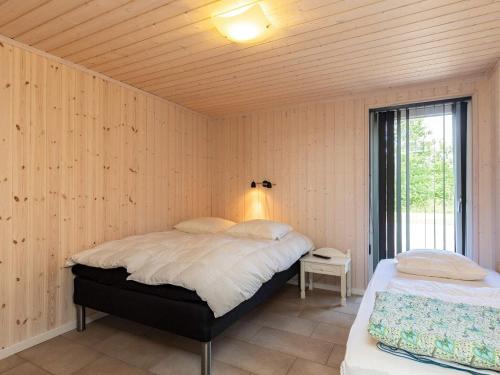 Postel nebo postele na pokoji v ubytování 15 person holiday home in Højslev