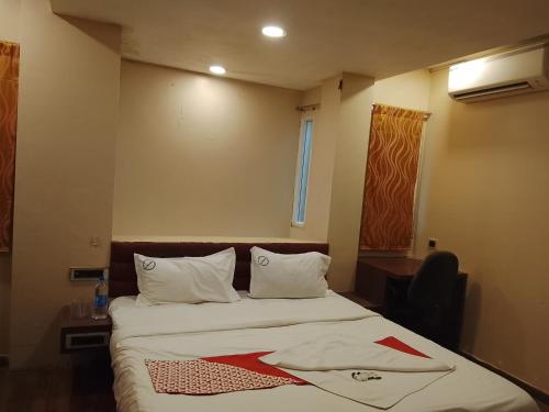 Postel nebo postele na pokoji v ubytování Saravana boutique inn