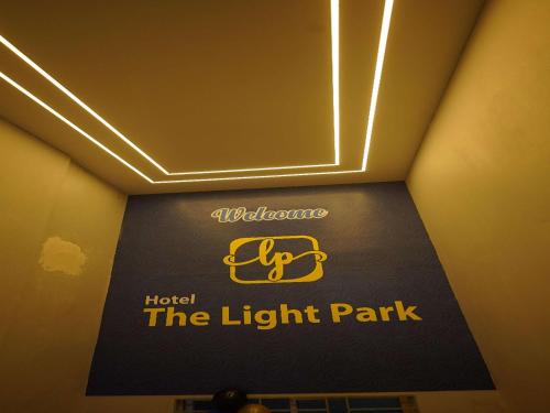 a sign for the light park in a hotel room at Hotel The Light Park in Chittagong