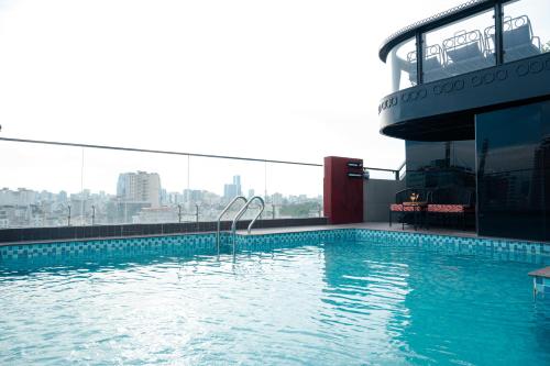 a swimming pool on the roof of a building at Champton Hanoi Hotel in Hanoi