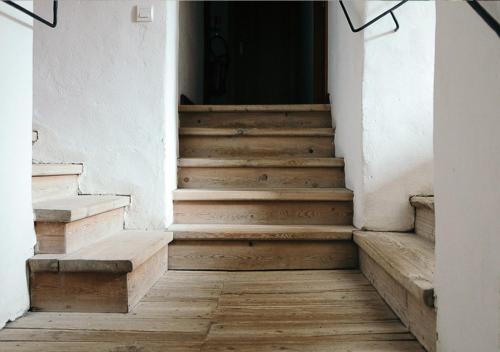 a set of stairs leading to a door at Langley Hotel La Vieille Ferme in La Salle Les Alpes