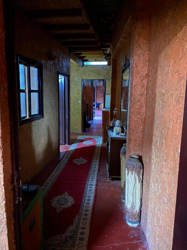 an empty hallway of a building with a room at Riad Espace Asrir in Tiznit