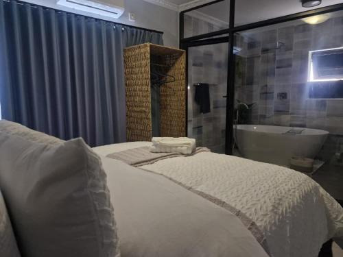 Ένα ή περισσότερα κρεβάτια σε δωμάτιο στο Nexovant Furnished Apartments