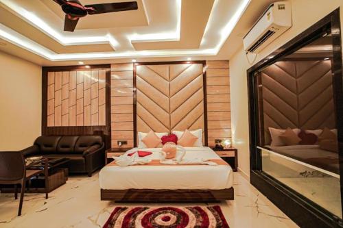 a bedroom with a bed and a living room at The Rath Inns in Mandarmoni