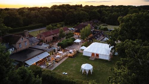 an aerial view of a wedding venue with a tent at Trading Boundaries in Uckfield