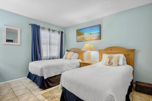 En eller flere senge i et værelse på Gulf Place 7B